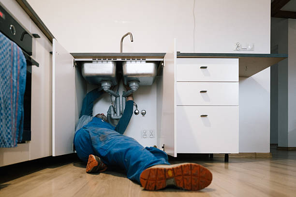 Professional Drain Cleaning technician working in Booneville, MS